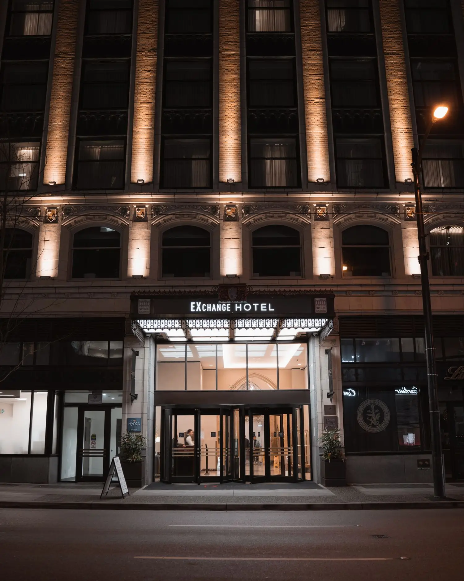 Elegant historic hotel entrance at night