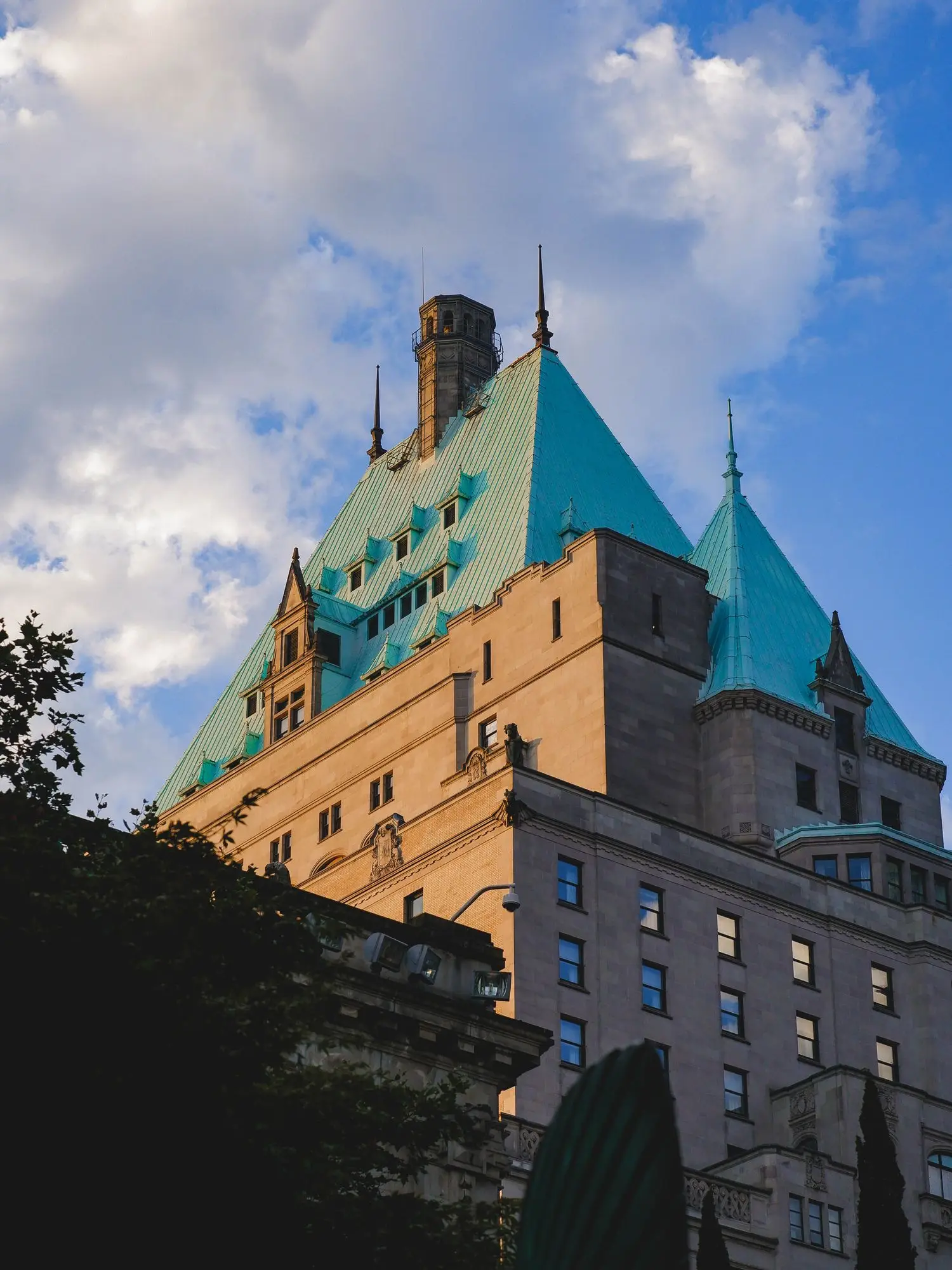 Historic Canadian stone hotel under a blue sky