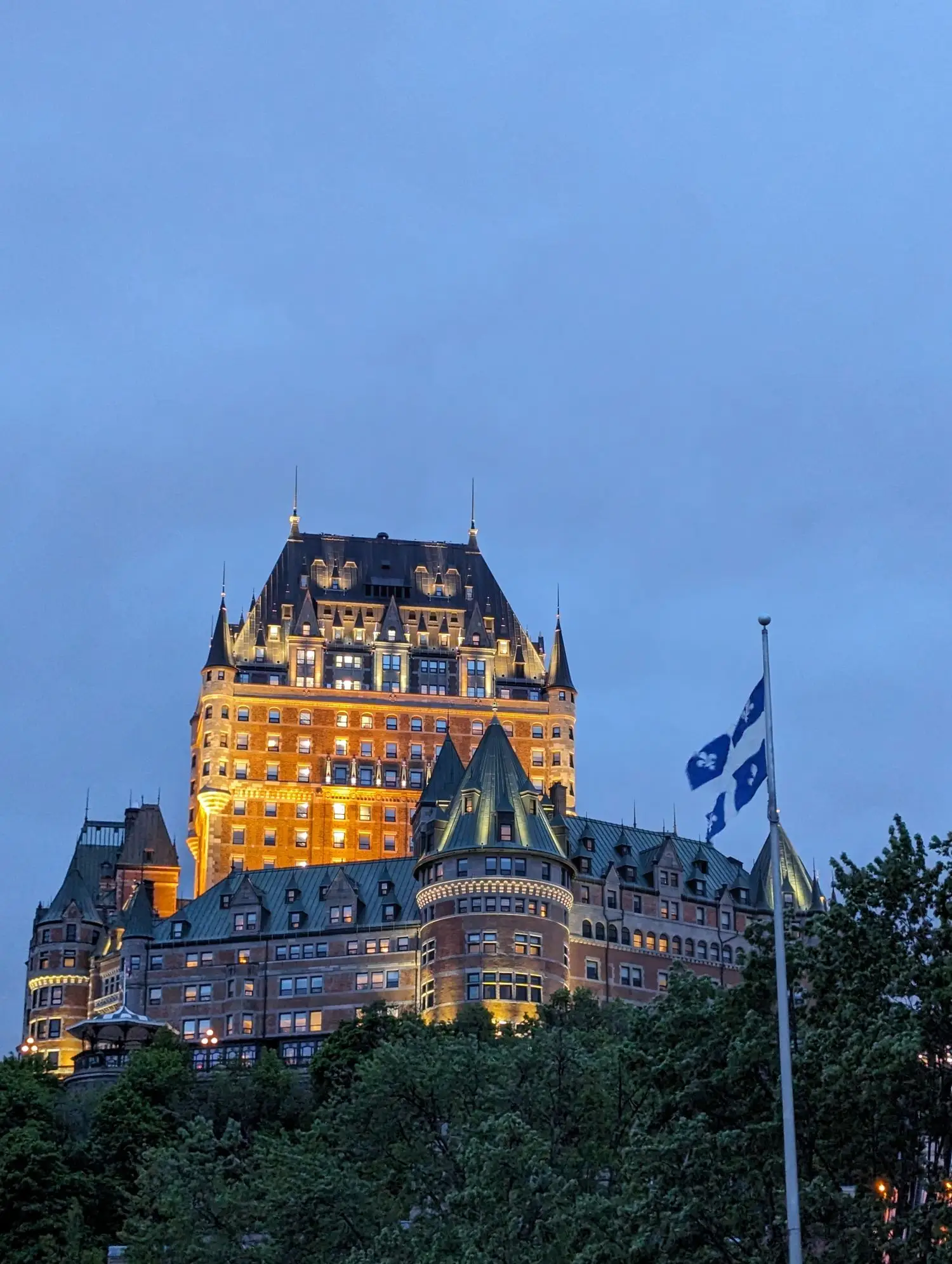 Illuminated heritage hotel at dusk