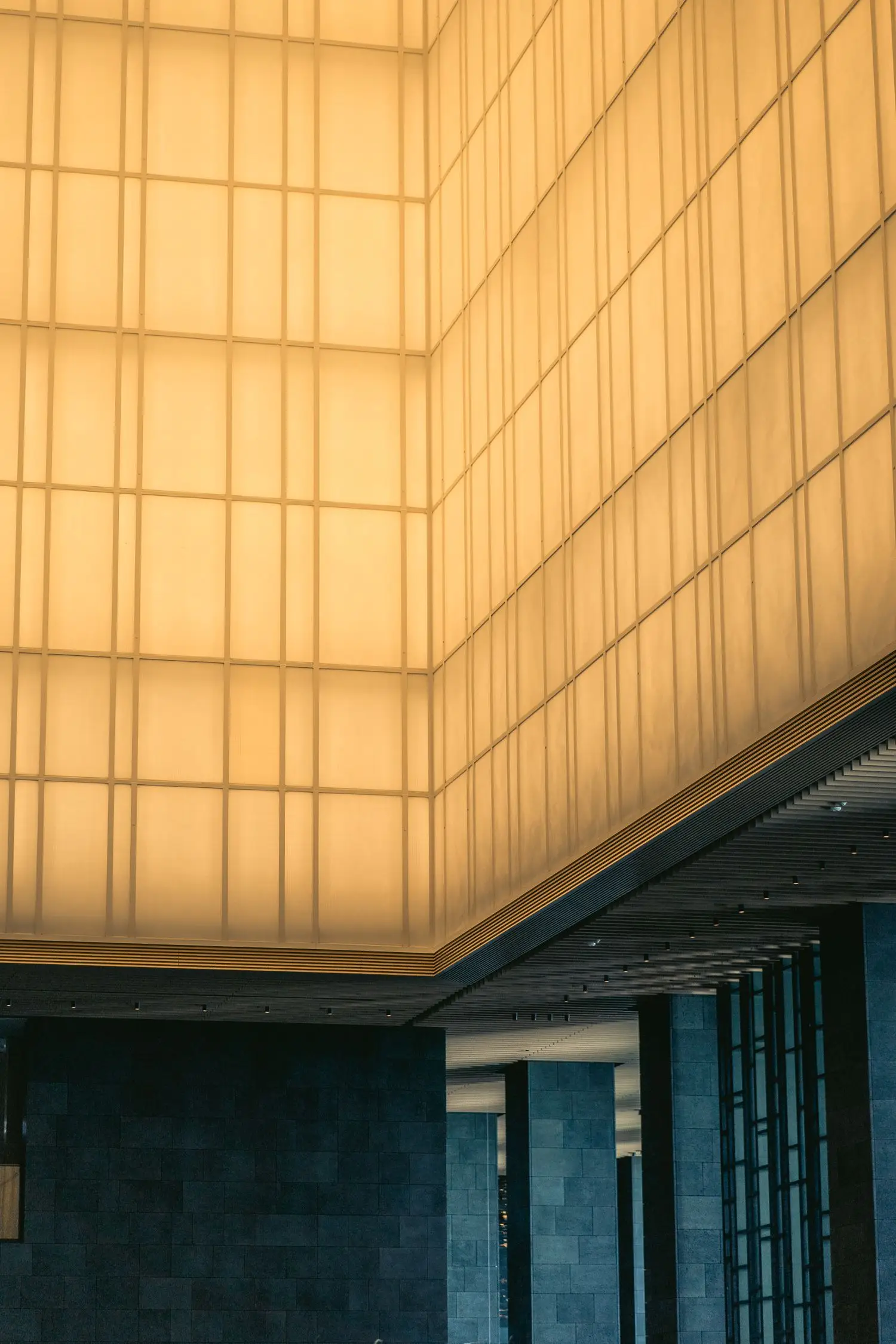 Contemporary illuminated architecture with warm geometric lines