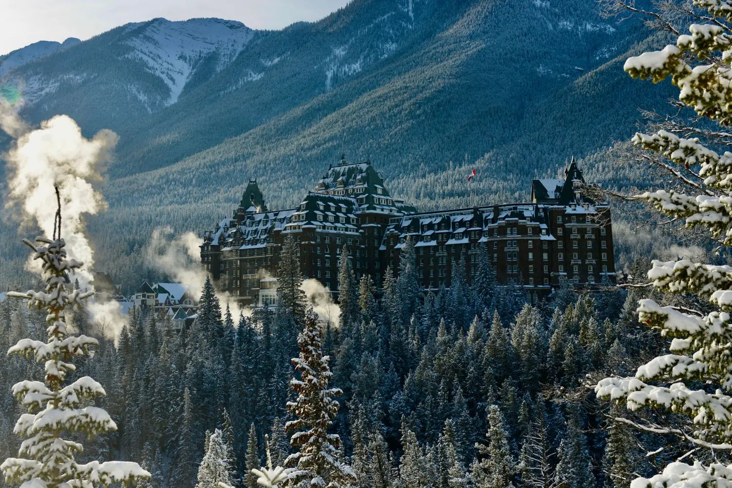 Rockies hotel surrounded by snow-covered mountains